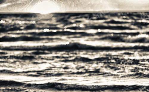 Preview: Blurred View Of Sunet Over The Ocean.