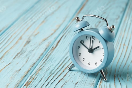 Preview: Alarm Clock On A Blue Rustic Background