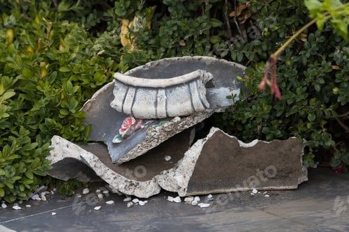 Preview: Suffered From Vandals Bowl Or A Vase Of Flowers. Flowerbed Broken By Hooligans In An Urban