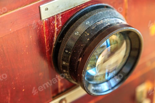 Preview: Lens Of A Vintage Wooden Camera Close-Up