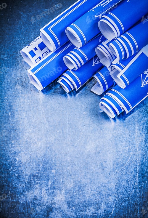 Preview: Pile Of Blue Rolled Construction Plans On Metallic Background Maintenance Concept.