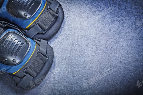 Preview: Protective Knee Pads On Black Background Construction Concept.