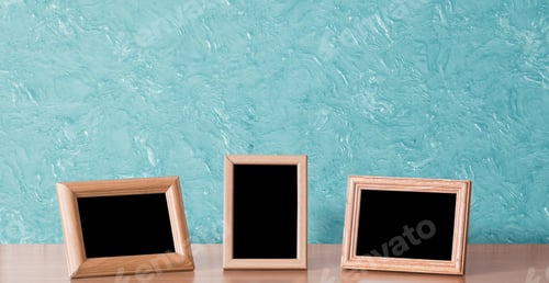 Preview: Wooden Photo Frames On Table, Blue Wall