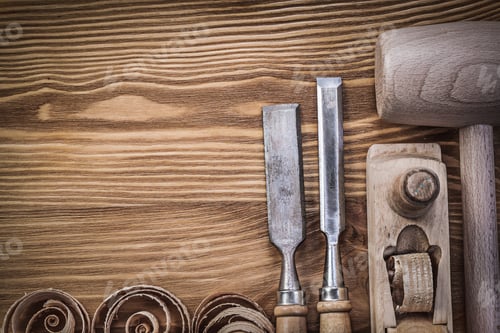 Preview: Wooden Hammer Planer Chisels Curled Shavings On Vintage Wood Board Construction Concept.