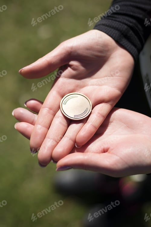 Preview: Young Woman Is Holding Medal In The Hands.