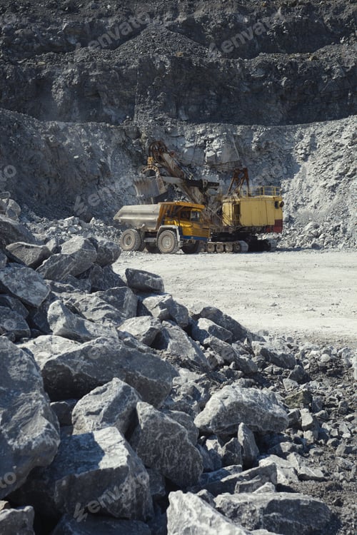 Preview: Mining Excavator And Mining Truck In A Quarry On The Background Of Rocky Terrain.