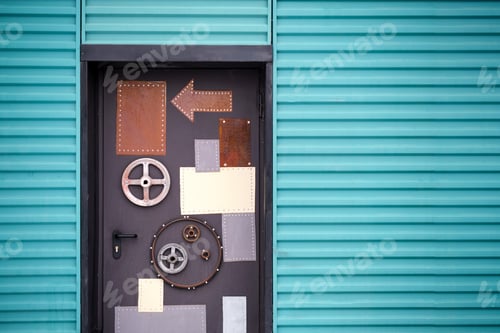Preview: Steampunk Handmade Door To The Workshop. Entrance With Arrows And Rotating Elements On An Unusual