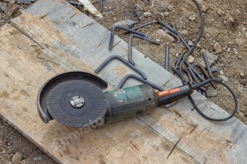 Preview: Angle Grinder After Cutting Spacer For The Rebar In A Concrete Post, Using Angle Grinder To