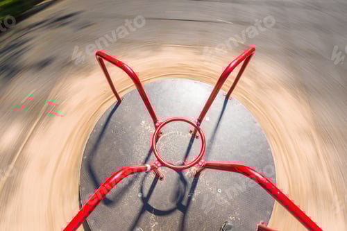 Preview: Standing On A Red Carousel In A Playground.
