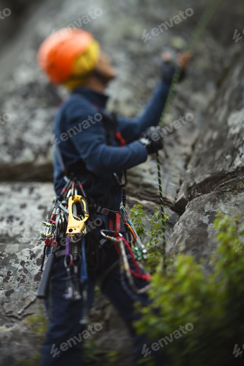 Preview: Abstract Blurred Image Of A Figure Of A Climber And Climbing Equipment.