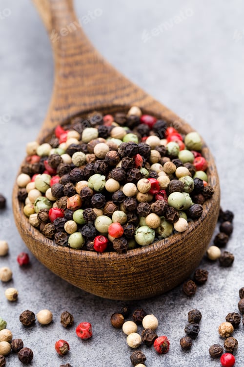 Preview: Peppercorn Mix In A Wooden Bowl On Grey Table.
