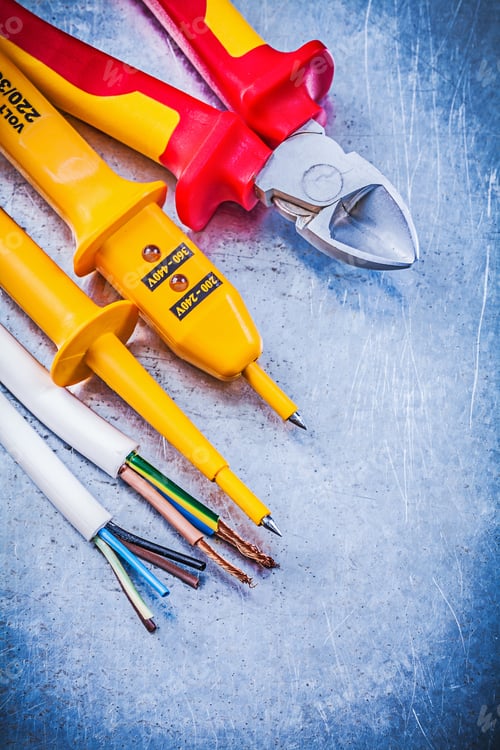 Preview: Yellow Electrical Tester Wires Cutting Pliers On Metallic Background Electricity Concept.