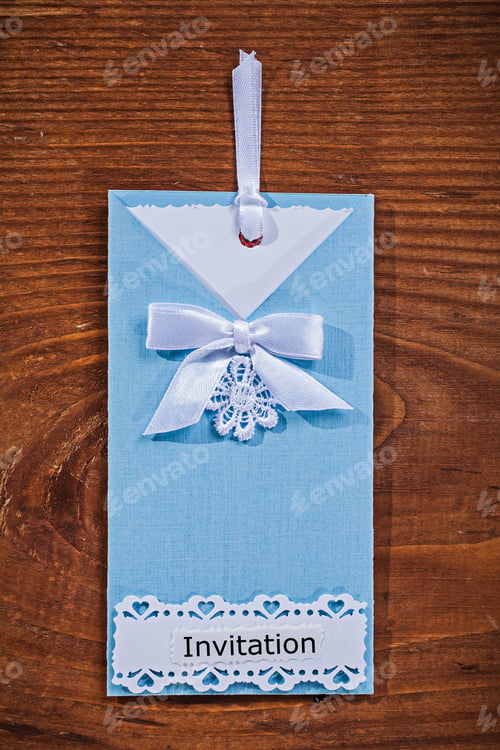 Preview: Beautiful Handmade Blue Vertical Invitation Envelope On Old Wooden Board