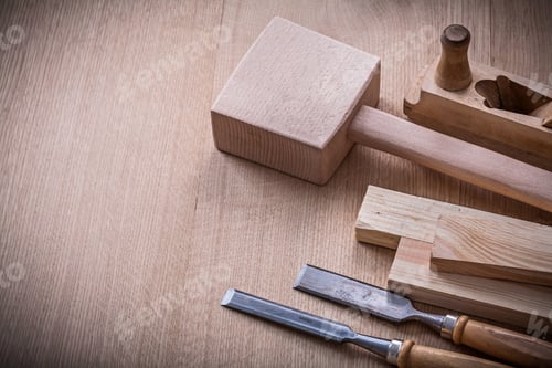 Preview: Lump Hammer Shaving Plane Metal Flat Chisels And Wooden Stud On Brown Board Construction Concept.