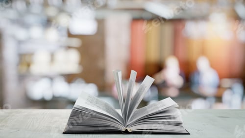 Preview: Open Book On White Table In A Night Club