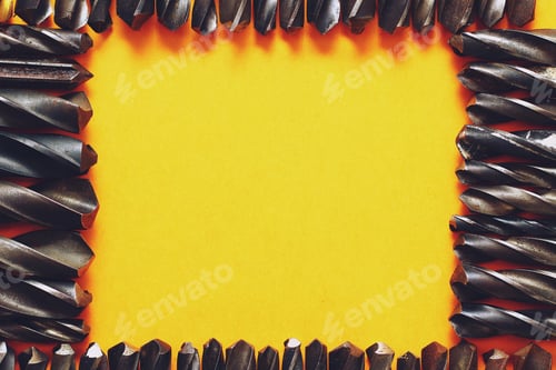 Preview: Many Drills Form A Frame For Placing An Inscription Or Text On A Trendy Yellow Background.