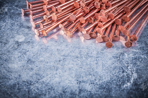 Preview: Brass Construction Nails On Metallic Background.