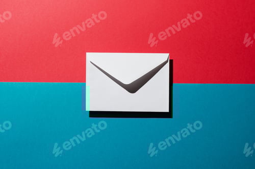 Preview: Envelope With Harsh Shadow Over Red And Blue Background, Top View