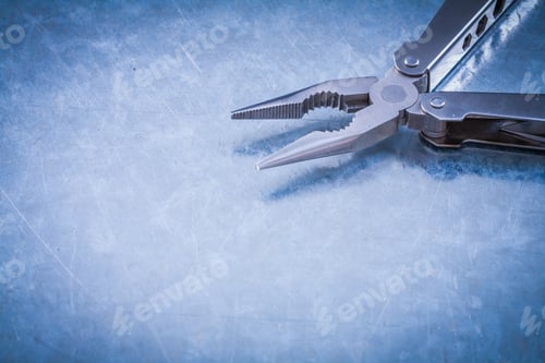 Preview: Stainless Nippers On Scratched Metallic Background Construction Concept.