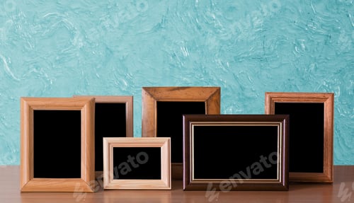 Preview: Wooden Photo Frames On Table, Blue Wall