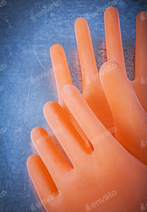 Preview: Electricians Rubber Gloves On Metallic Background.