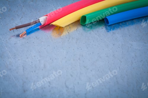 Preview: Wire Protection And Copper Cables On Scratched Metallic Background.