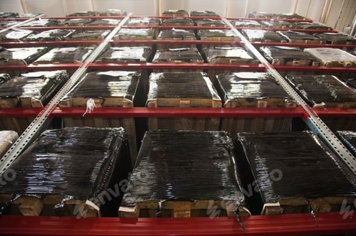 Preview: Interior Of Warehouse. Rows Of Shelves With Boxes. Forklift Loader Worker Driver At Warehouse