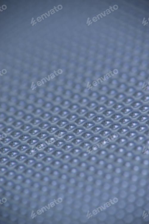 Preview: Perforated Metal Sheet On Dark Blue Background