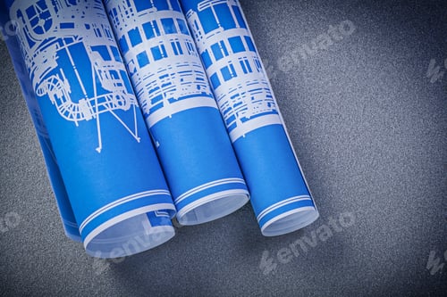 Preview: Blue Blueprint Rolls On Grey Surface Construction Concept.