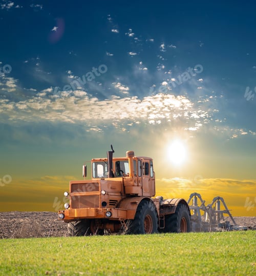 Preview: Tractor Cultivating The Field On The Sunny Day