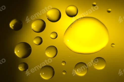 Preview: Yellow Cooking Oil Bubble And Drops On Water For Background.