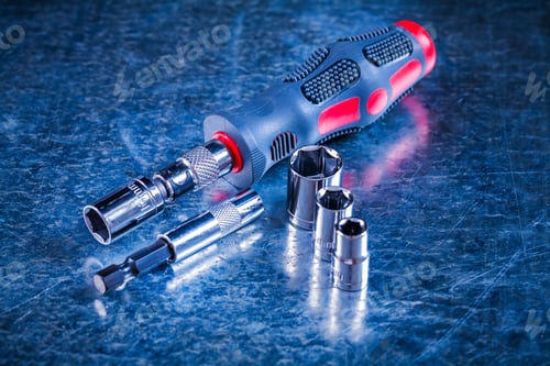 Preview: Screwdriver Bit Holders Replaceable Torxes On Scratched Metallic Background Construction Concept.