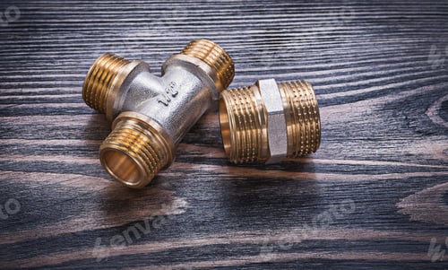Preview: Brass Equal Tee Hose Nipple On Wooden Background Plumbing Concept.
