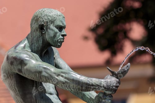 Preview: Fisherman With Snake Statue Fountain At Jesuit Square