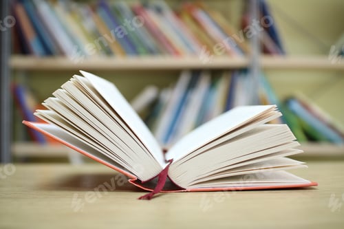 Preview: Open Book On The Table In Library