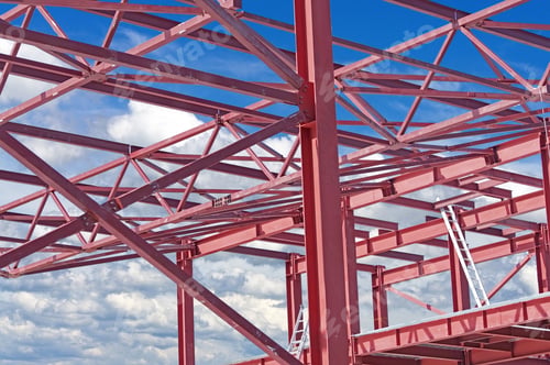 Preview: Steel Frames Of A Building Under Construction On A Background Blue Sky