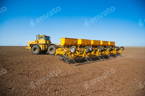 Preview: Farmer In Tractor Preparing Farmland With Seedbed For The Next Year