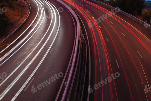 Preview: A Night Time Shot Of Speeding Traffic On A Freeway