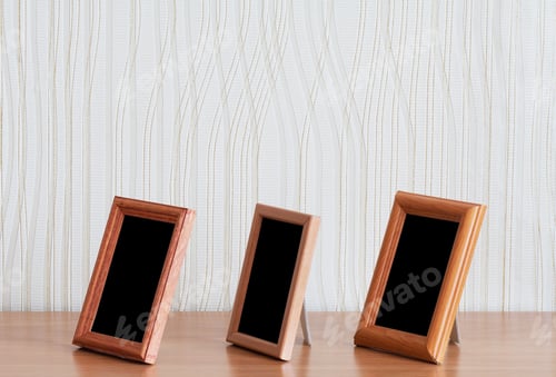 Preview: Photo Frames On Wooden Table