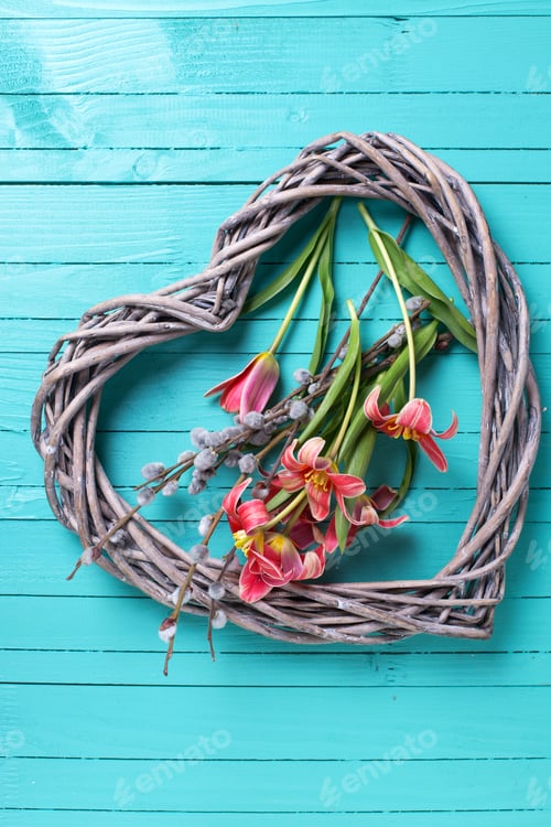 Preview: Fresh Spring Yellow Tulips Flowers And Decorative Heart On Green Painted Wooden Planks. Selective