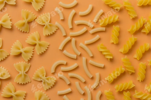 Preview: Different Types Of Pasta On An Orange Background