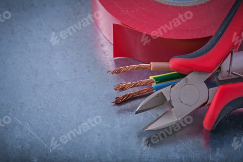 Preview: Insulation Tape Nippers Electric Wires On Metallic Background Construction Concept.