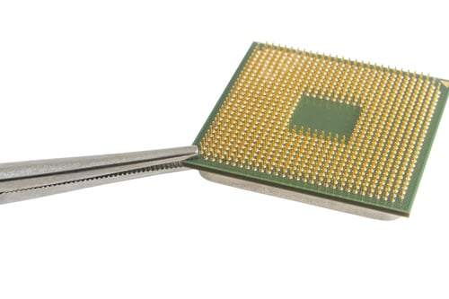 Preview: The Forceps Holds Cpu. Image Isolated On White Background