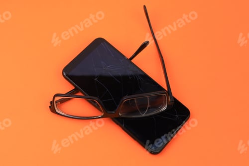 Preview: Broken Glasses And Smartphone. Selective Focus. Background