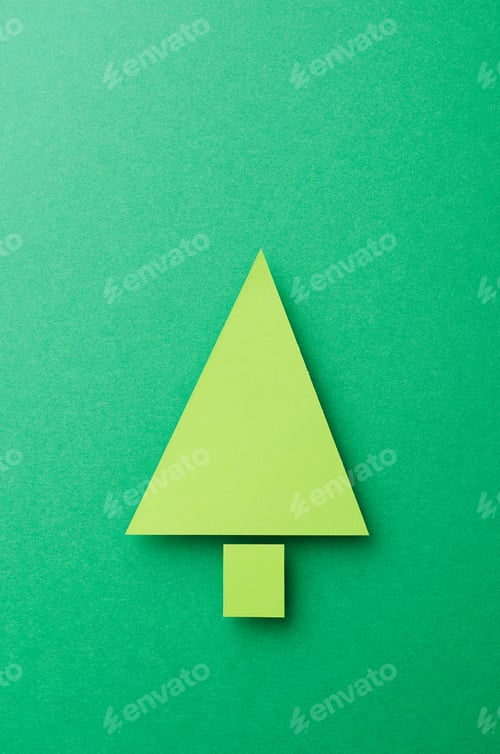 Preview: Paper Christmas Tree Cut From Green Paper Over Green Background, Top View