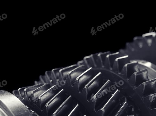 Preview: Metal Gear Reducer Isolated On Black Background. Studio High-Resolution Image.