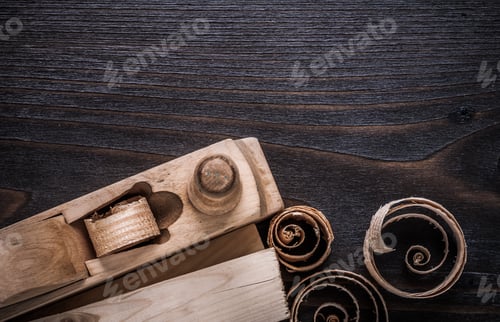 Preview: Wooden Shaving Plane Studs And Planing Chips On Vintage Wood Board Construction Concept.