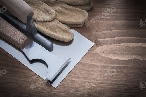 Preview: Putty Knife Plastering Trowel And Leather Safety Gloves Construction Concept.