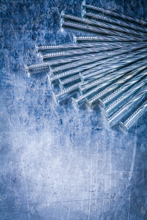 Preview: Collection Of Stainless Construction Nails On Scratched Metallic Surface Building Concept.