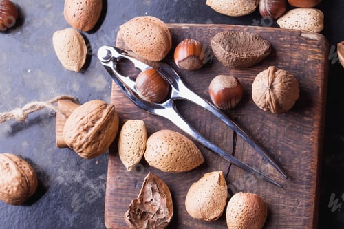 Preview: Selection Of Various Nuts: Almonds, Brazilian, Walnuts On Tiny Vintage Wooden Boards, Black